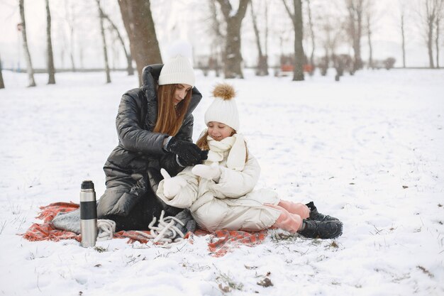 Family in knitted winter hats on vacation