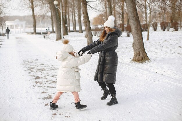 Family in knitted winter hats on vacation