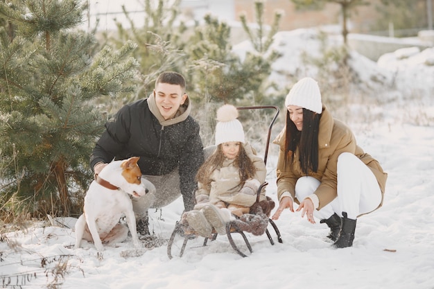 Free Photo family in knitted winter hats on vacation