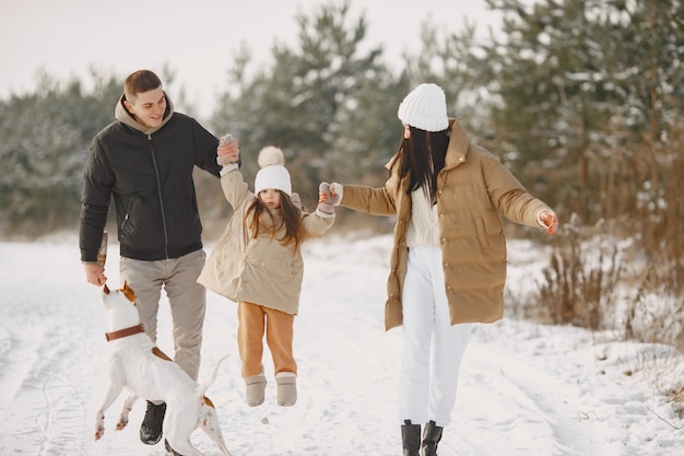 Family in knitted winter hats on vacation