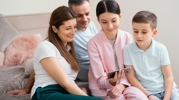 Family members using a mobile phone