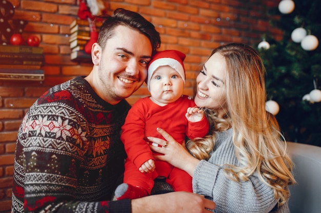 Family near Christmas tree