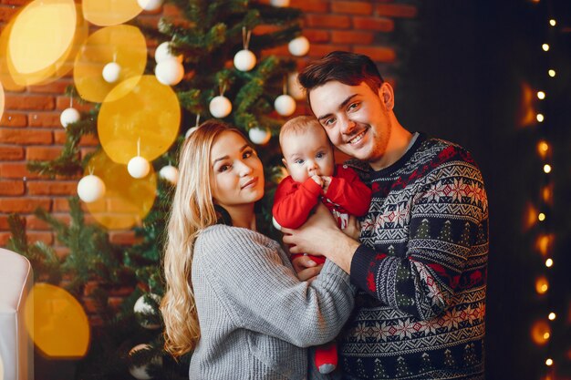 Family near Christmas tree