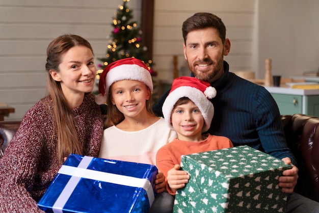 Family opening presents on christmas day