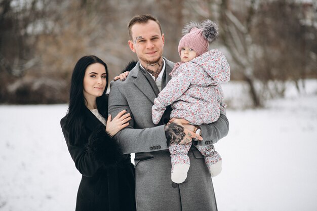 Family in park in winter with daughter