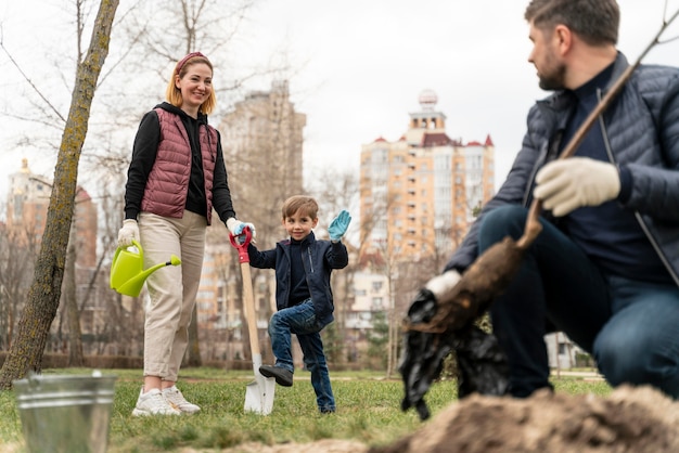 Free photo family plating together in the ground outdoors