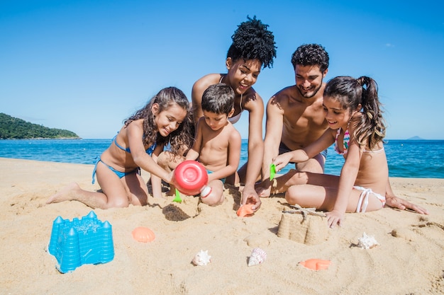 Family playing with the sand