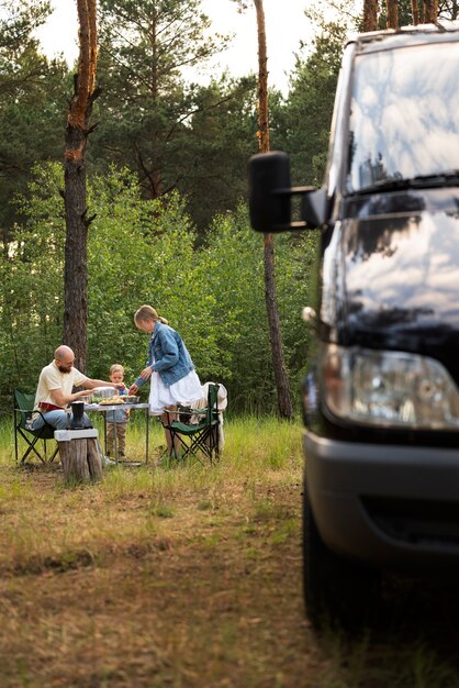 Family preparing dinner while in camping