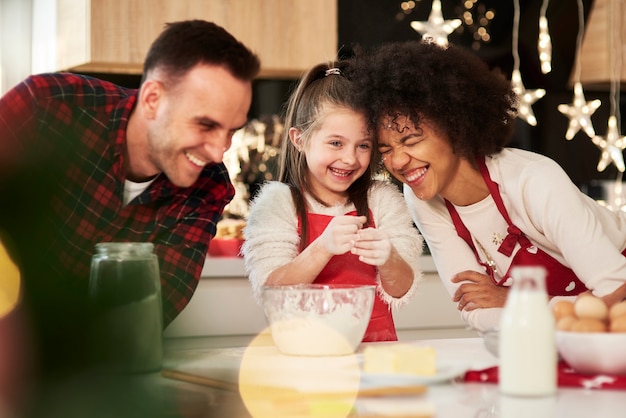 Family preparing snack in kitchen