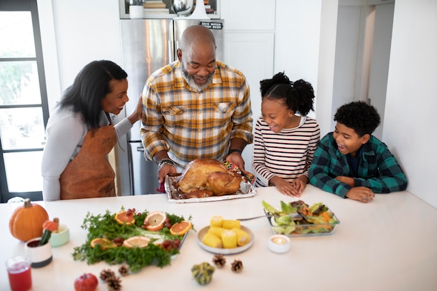 Family preparing the thanksgiving day turkey