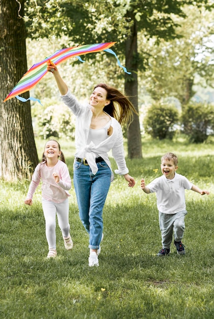 Family running with a kite