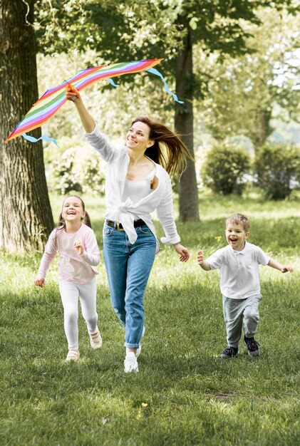 Family running with a kite