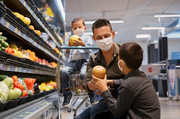 Free photo family shopping with face mask