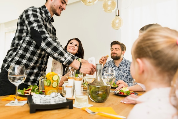 Free photo family sitting at the table