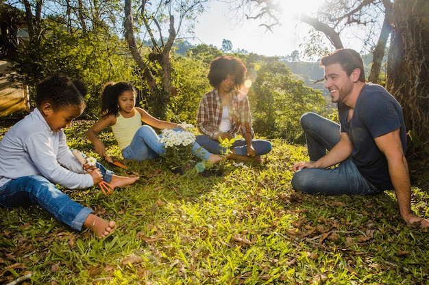 Family sitting together in the countryside