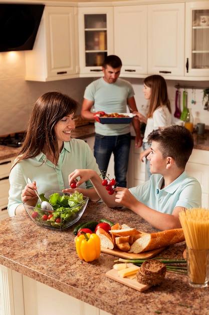 Free photo family spending time in the kitchen preparing food