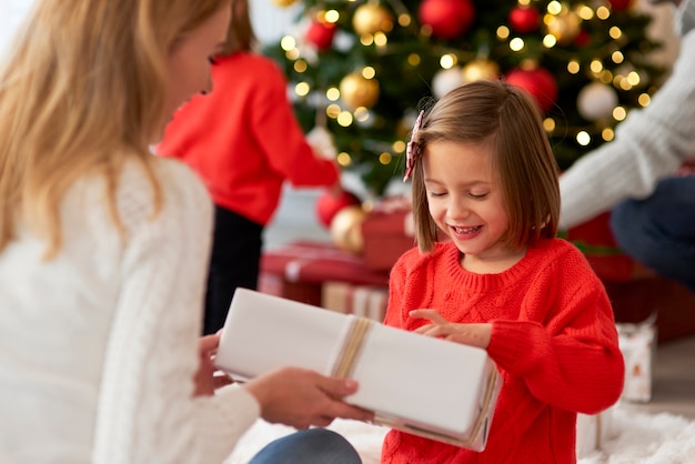 Family starting Christmas from opening presents