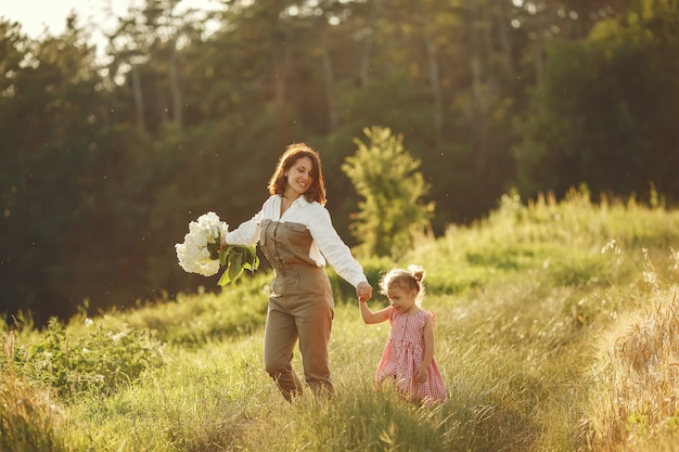 Family in a summer field. Sensual photo. Cute little girl.