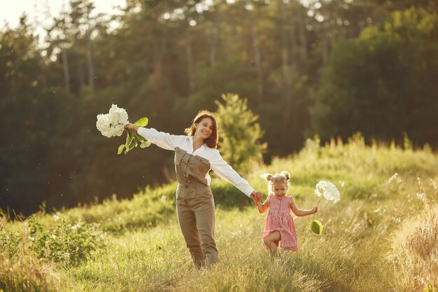 Family in a summer field. Sensual photo. Cute little girl.