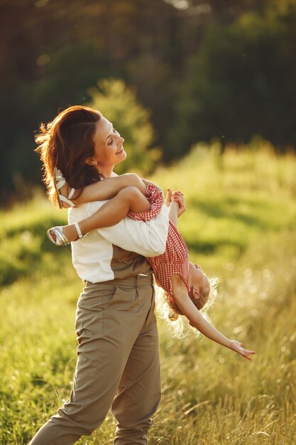 Family in a summer field. Sensual photo. Cute little girl.