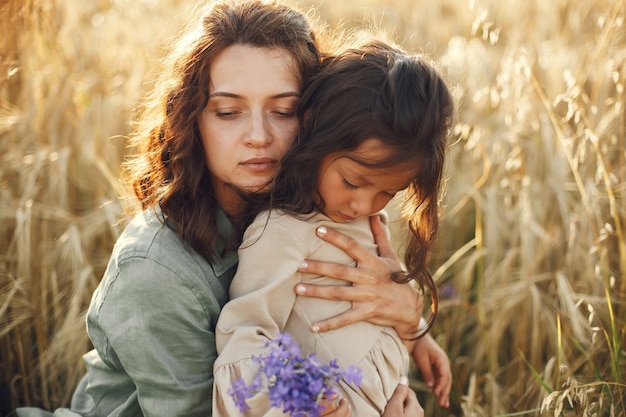 Free photo family in a summer field. sensual photo. cute little girl.