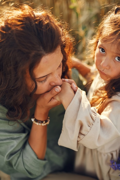 Family in a summer field. Sensual photo. Cute little girl.