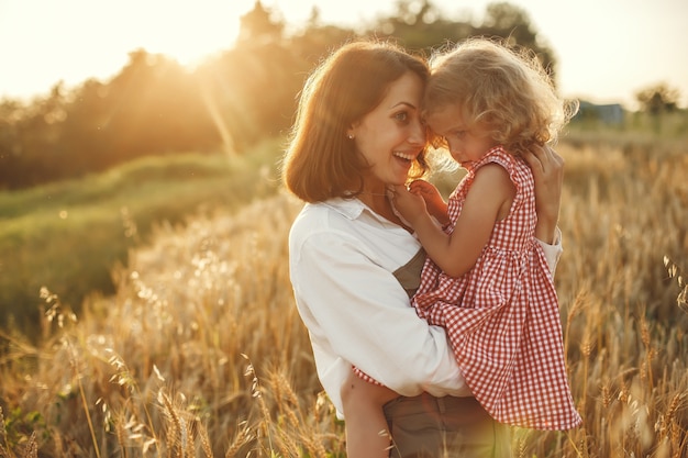 Family in a summer field. Sensual photo. Cute little girl.