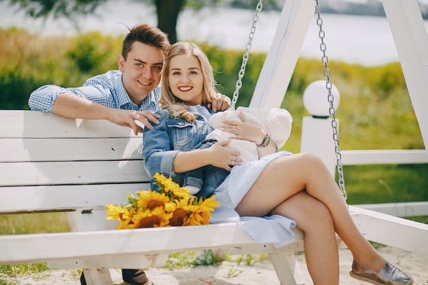 Free photo family on a swing