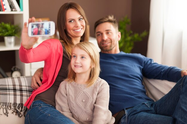 Family taking self portrait photography by mobile phone