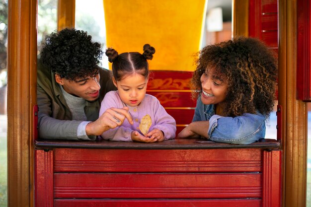 Family of three spending time together outdoors on father's day