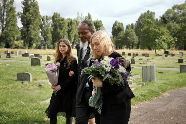 Family visiting grave of loved one