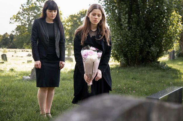 Family visiting grave of loved one