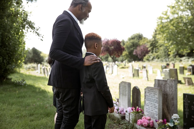 Family visiting grave of loved one