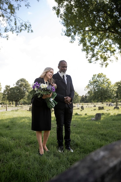 Family visiting grave of loved one