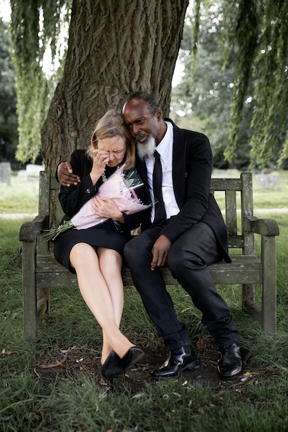 Family visiting grave of loved one