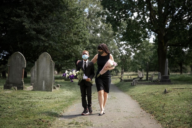 Family visiting grave of loved one