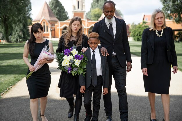 Family visiting grave of loved one