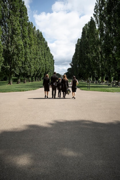 Family visiting grave of loved one