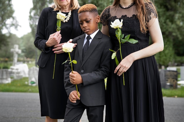 Family visiting grave of loved one