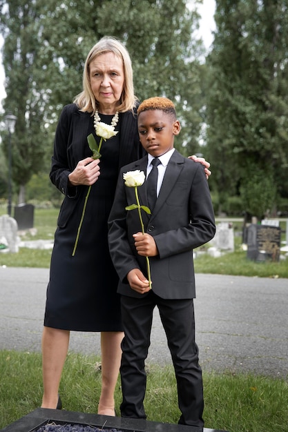 Family visiting grave of loved one