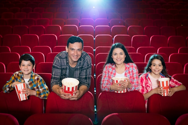 Family watching movie in cinema