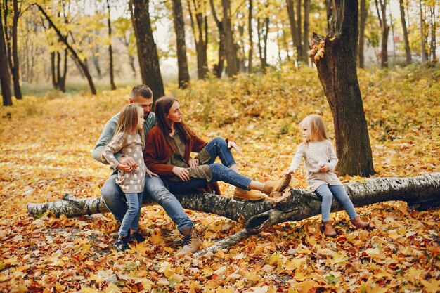 Family with cute kids in a autumn park