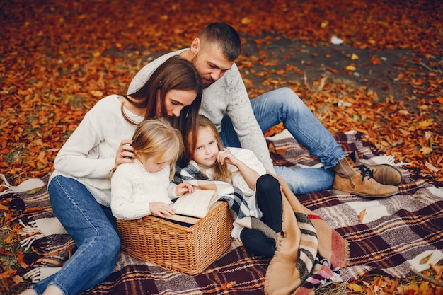 Family with cute kids in a autumn park