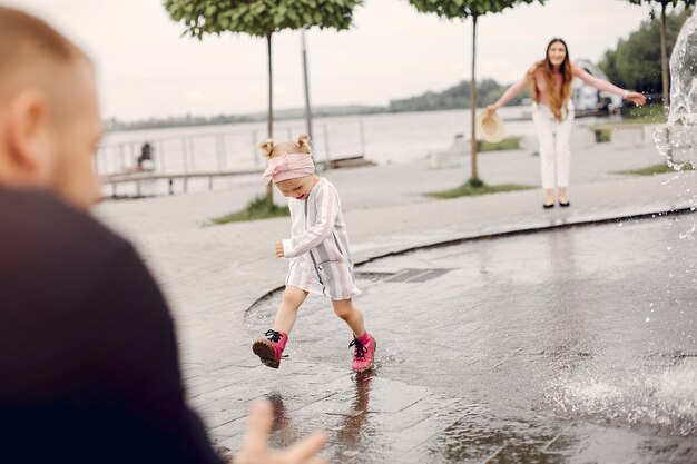 Family with daughter playing in a park