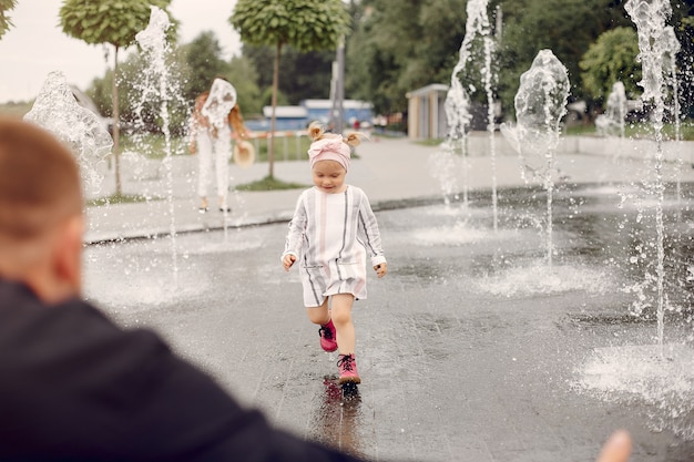 Family with daughter playing in a park