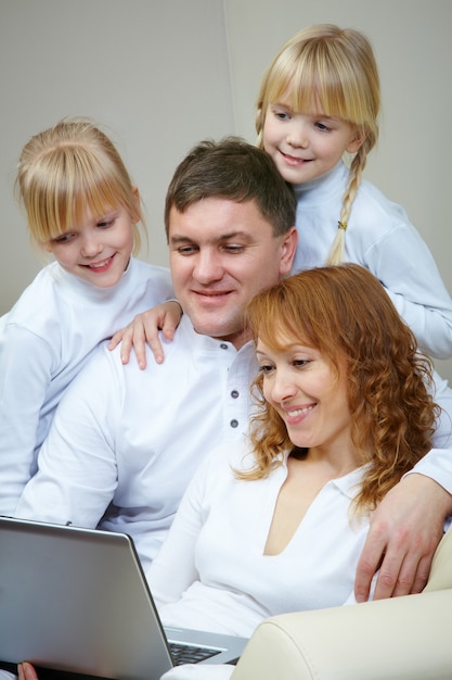 Free Photo family with laptop