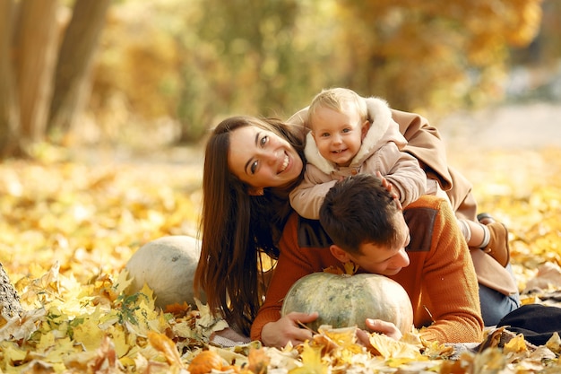 Family with little daughter in a autumn park