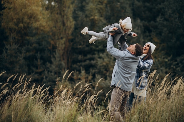 Free Photo family with little daughter together in autumnal weather having fun