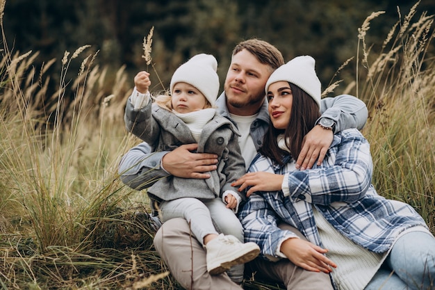 Free Photo family with little daughter together in autumnal weather having fun