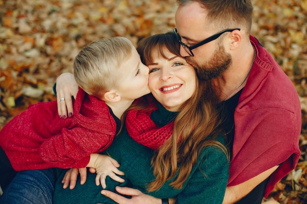 Free photo family with little son in a autumn park